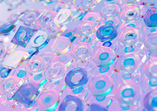 A close up of clear glass tiles against a clear purple backgrounds, lit with pink and blue gels