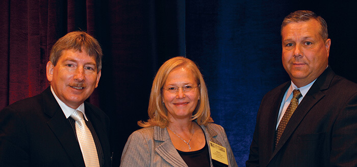 Joyce standing with David Jaworski and Martin VanTrieste at the 2011 Glass Quality Conference