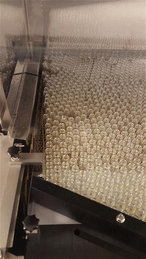 A manufacturing line full of glass vials